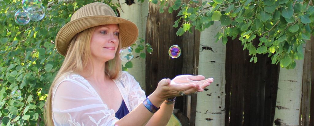 Gale Schadewald catching bubbles outside
