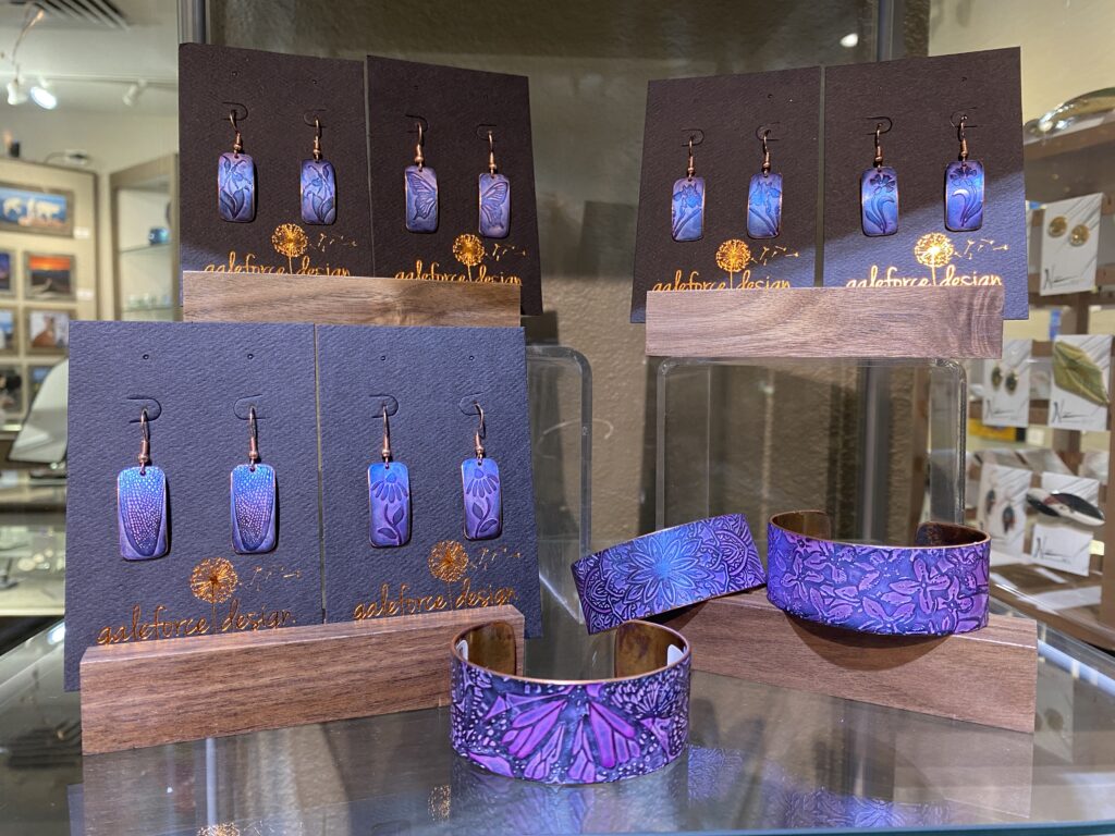 A selection of nature-inspired copper acid-etched jewelry at the Evergreen Gallery. Made by Gale Schadewald.