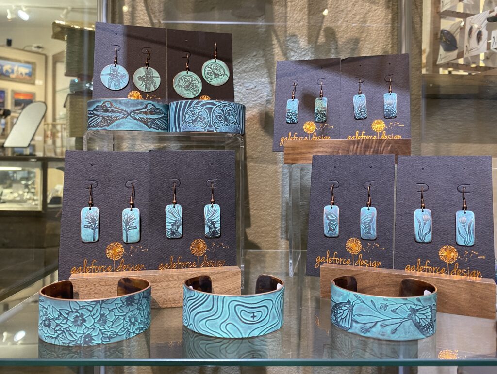 A selection of nature-inspired copper-etched jewelry at the Evergreen Gallery. Made by Gale Schadewald.